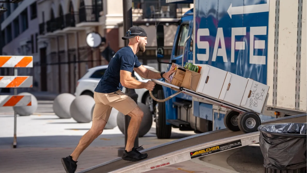 Safebound mover putting things on the truck for office moving