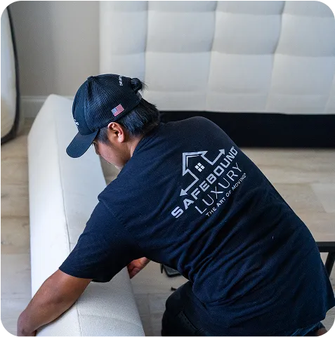 man wrapping a bed frame